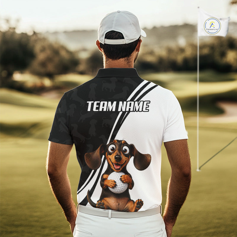 A man viewed from behind wearing a custom printed polo shirt on a golf course. The back of the shirt is split vertically with a black left side featuring dog silhouettes and the text 'TEAM NAME', and a white right side with diagonal stripes and a cartoon dachshund holding a golf ball.