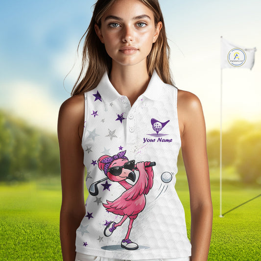 Woman wearing a white sleeveless golf shirt with a pink flamingo design on a golf course.