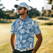 Load image into Gallery viewer, Man wearing a blue tropical patterned shirt on a golf course 