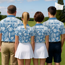 Load image into Gallery viewer, Four people wearing matching blue shirts with a team name on a golf course.