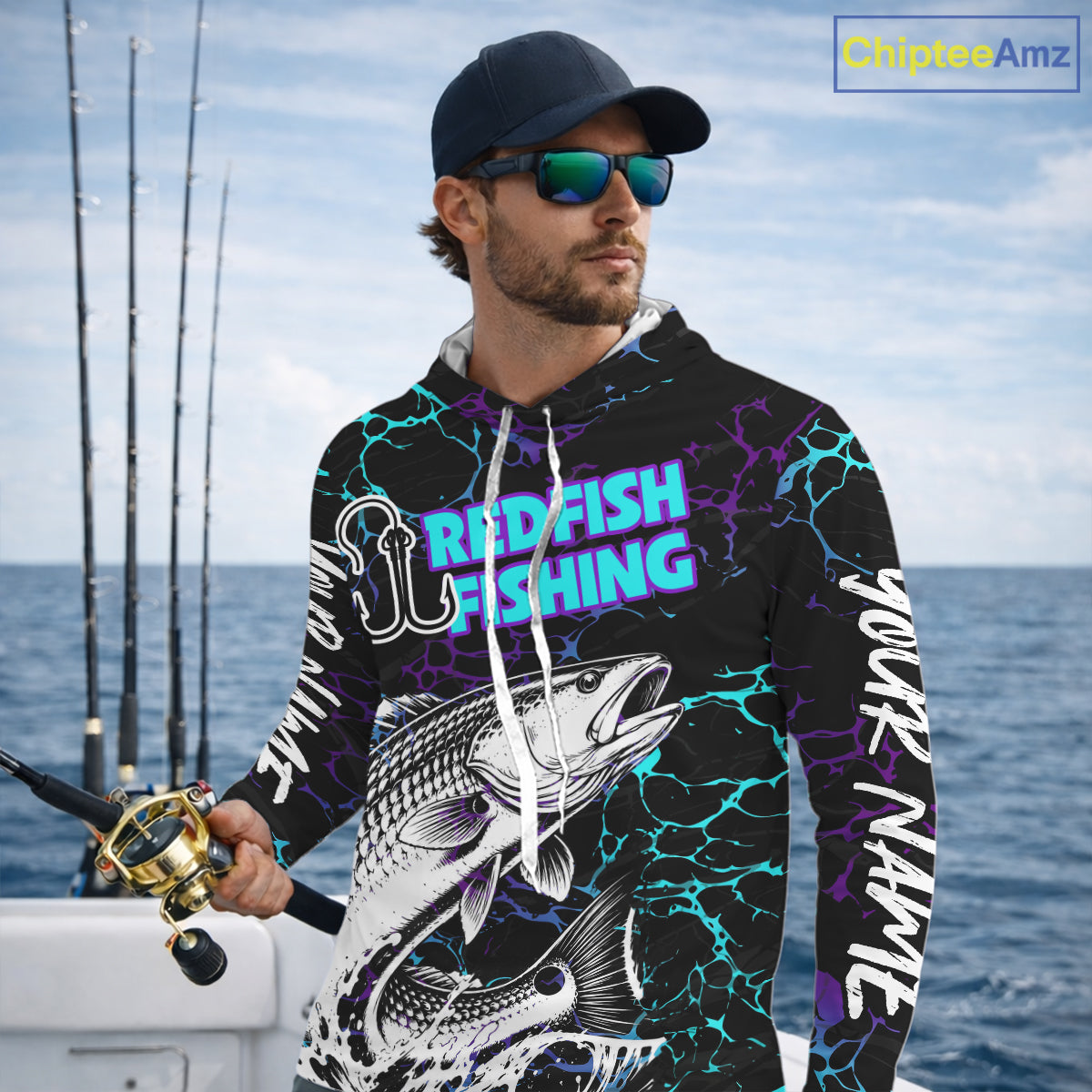 Angler wearing Redfish Fishing neon blue long sleeve hooded saltwater fishing shirt on the boat