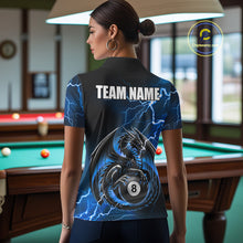 Load image into Gallery viewer, Back view of woman wearing a blue thunder lightning dragon 8 ball pool shirt in a billiards hall.