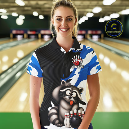 Woman wearing a custom bowling shirt with a raccoon design in a bowling alley.