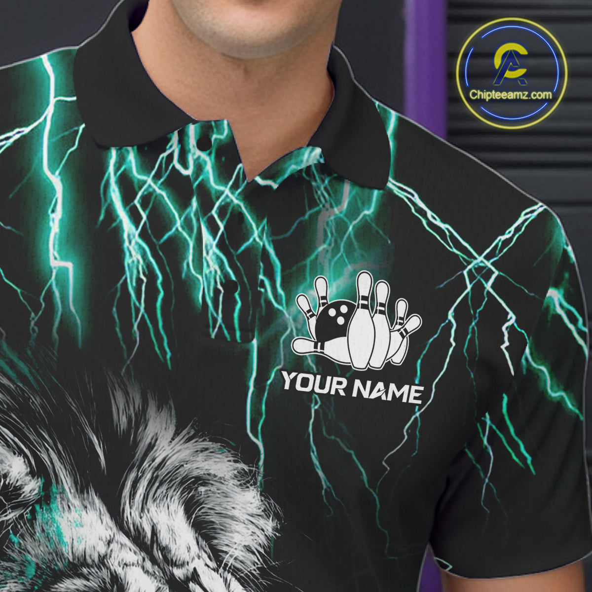 Close up of collar, chest and button details on a black and turquoise thunder lightning lion men's bowling polo shirt.