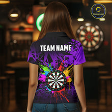 Load image into Gallery viewer, Back view of woman wearing a colorful purple darts jersey inside a darts hall.