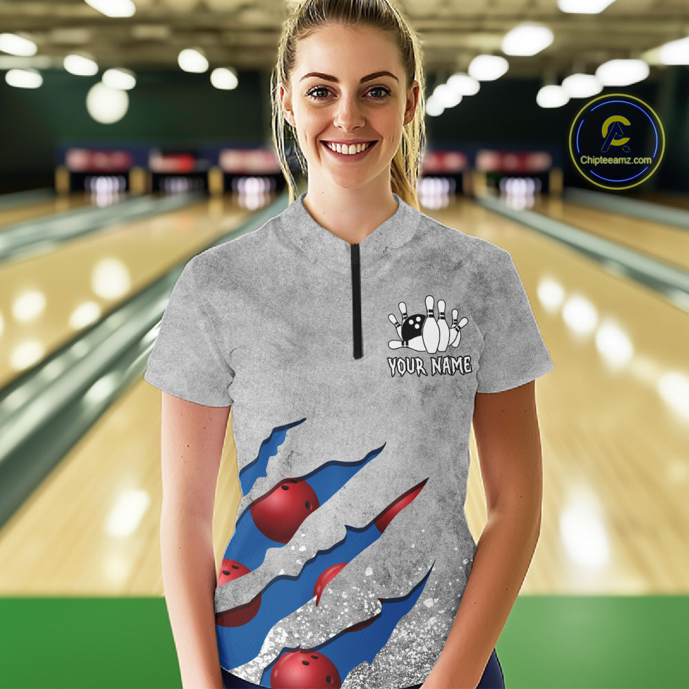Woman wearing a blue grunge scratch quarter zip bowling shirt front view, personalized bowling team apparel.