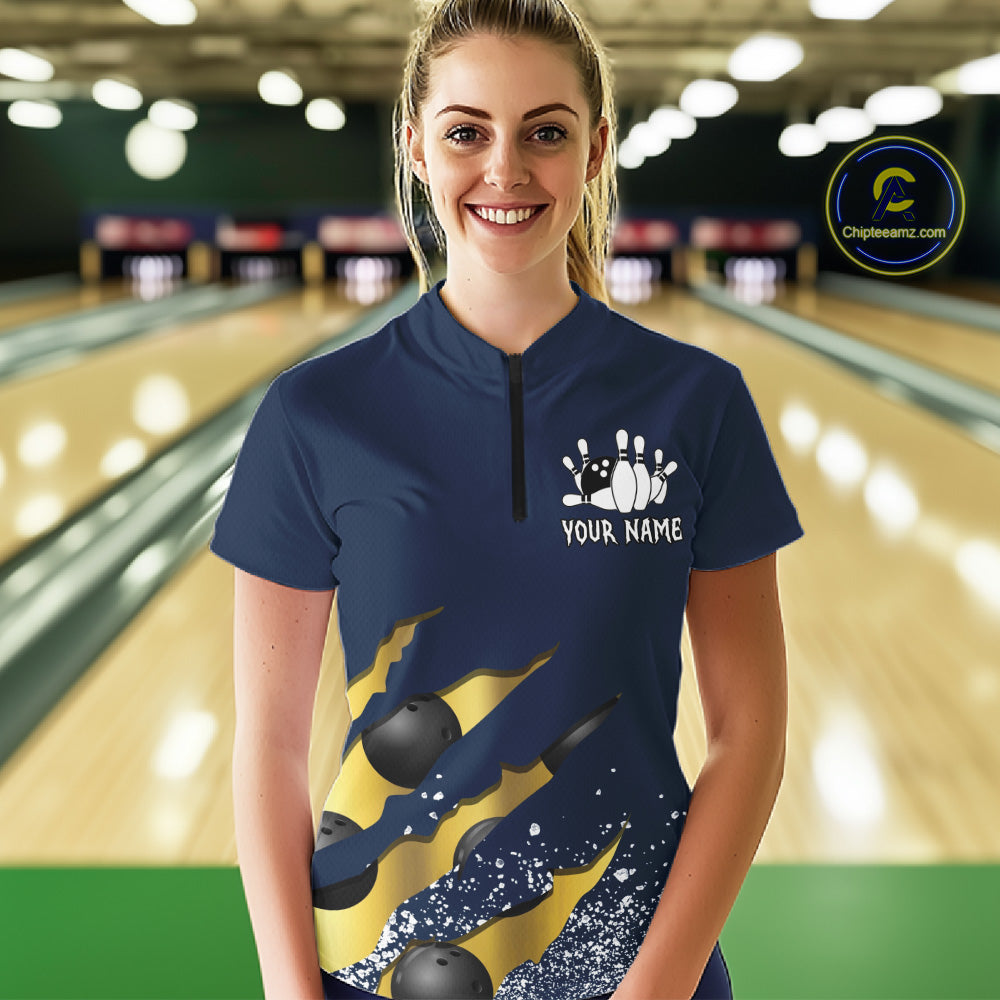 Woman wearing a navy blue and gold grunge scratch quarter zip bowling shirt front view, personalized bowling team apparel.