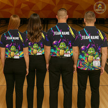Load image into Gallery viewer, Four people wearing matching shirts with a turtle graphic and 'TEAM NAME' text on a bowling alley background.