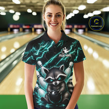 Load image into Gallery viewer, Woman wearing a turquoise neon lightning raccoon bowling polo shirt at a bowling alley front view.