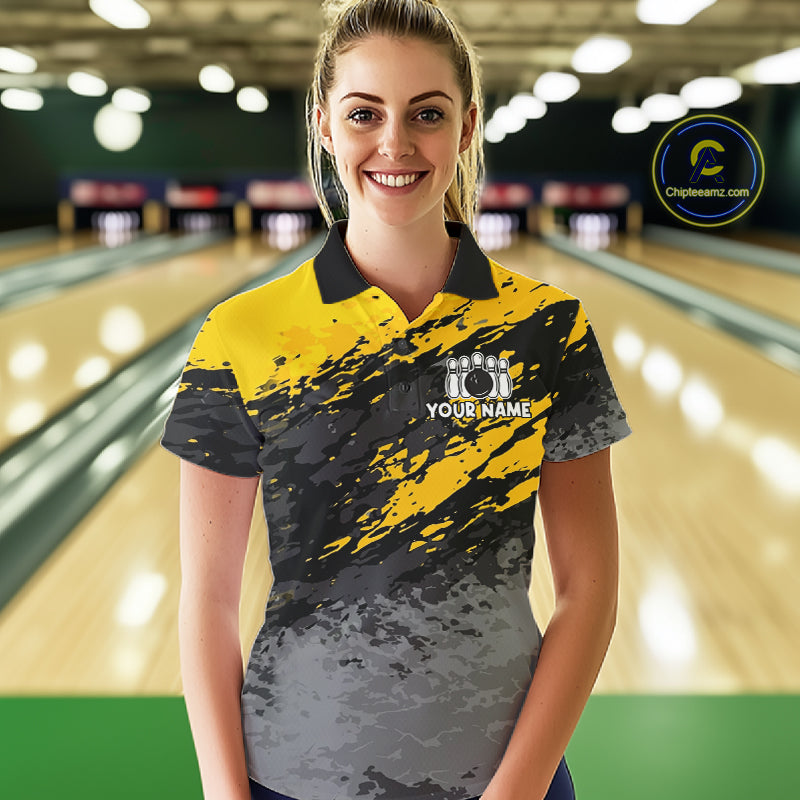 Woman wearing a yellow funny banana bowling polo shirt at a bowling alley front view.