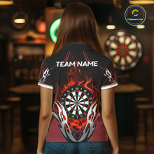 Load image into Gallery viewer, Back view of woman wearing a red flaming silver darts shirt.