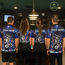 Load image into Gallery viewer, Back view of pool players wearing matching raccoon 8 ball billiard shirts in a game room.