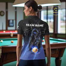 Load image into Gallery viewer, Back view of woman wearing a blue grim reaper lightning 9 ball pool shirt in a billiards hall.