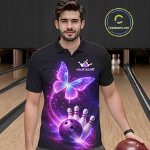 Load image into Gallery viewer, Man wearing a black bowling shirt with a colorful butterfly design in a bowling alley.