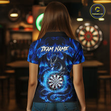 Load image into Gallery viewer, Back view of woman wearing a blue flame dragon darts jersey inside a darts arena.